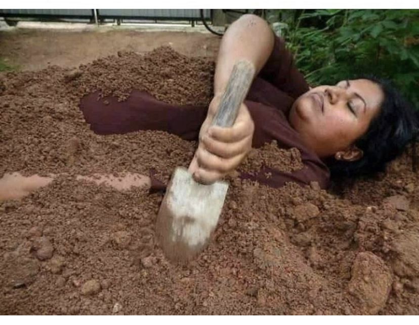 WOMAN BURYING SELF MEME